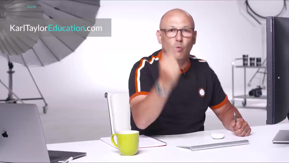 Instructor reviewing student submissions against original brief
